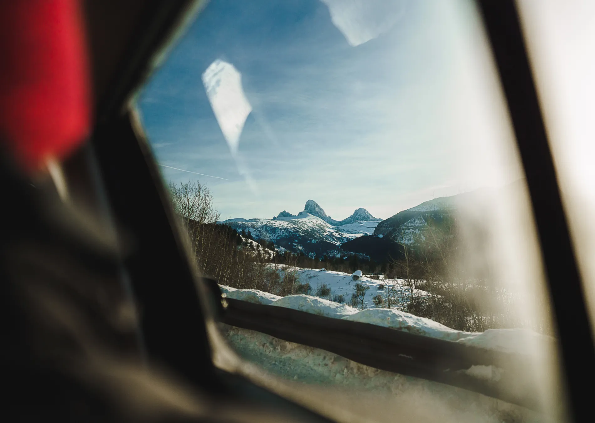 A view of mountains through a car window