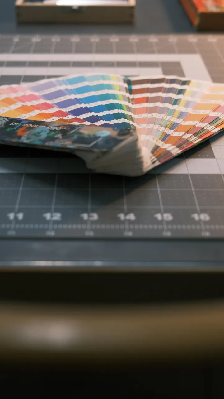 A Pantone swatch book on a desk