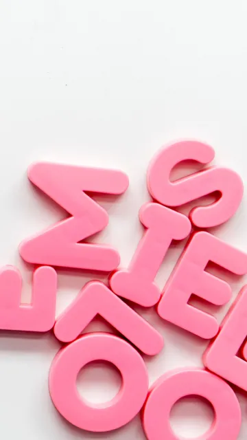pink random letters on a white background