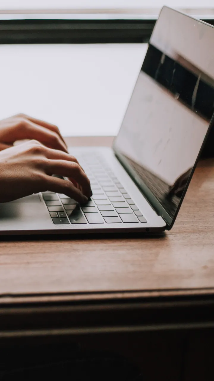 Person typing on a laptop