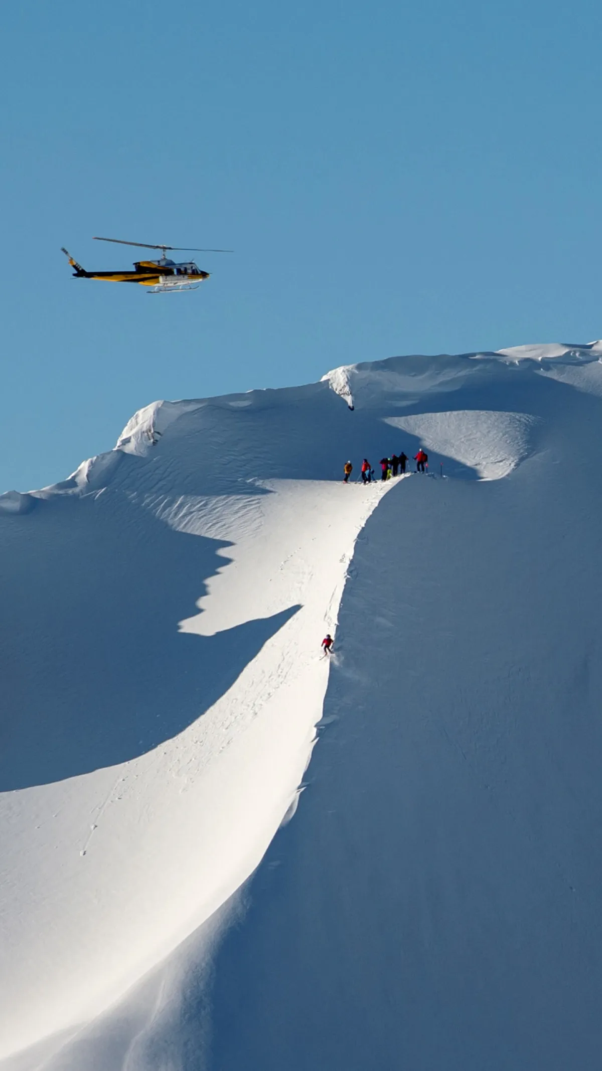 People heli-skiing