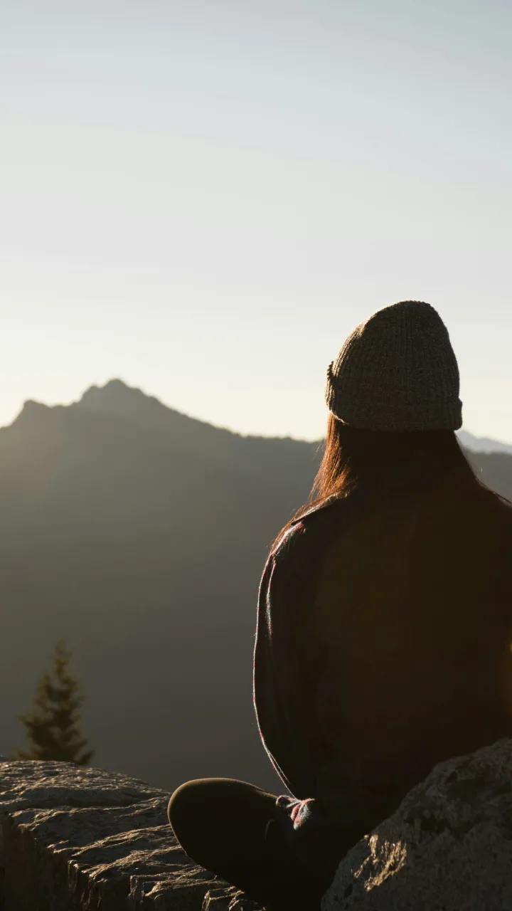 A person sitting on a mountain