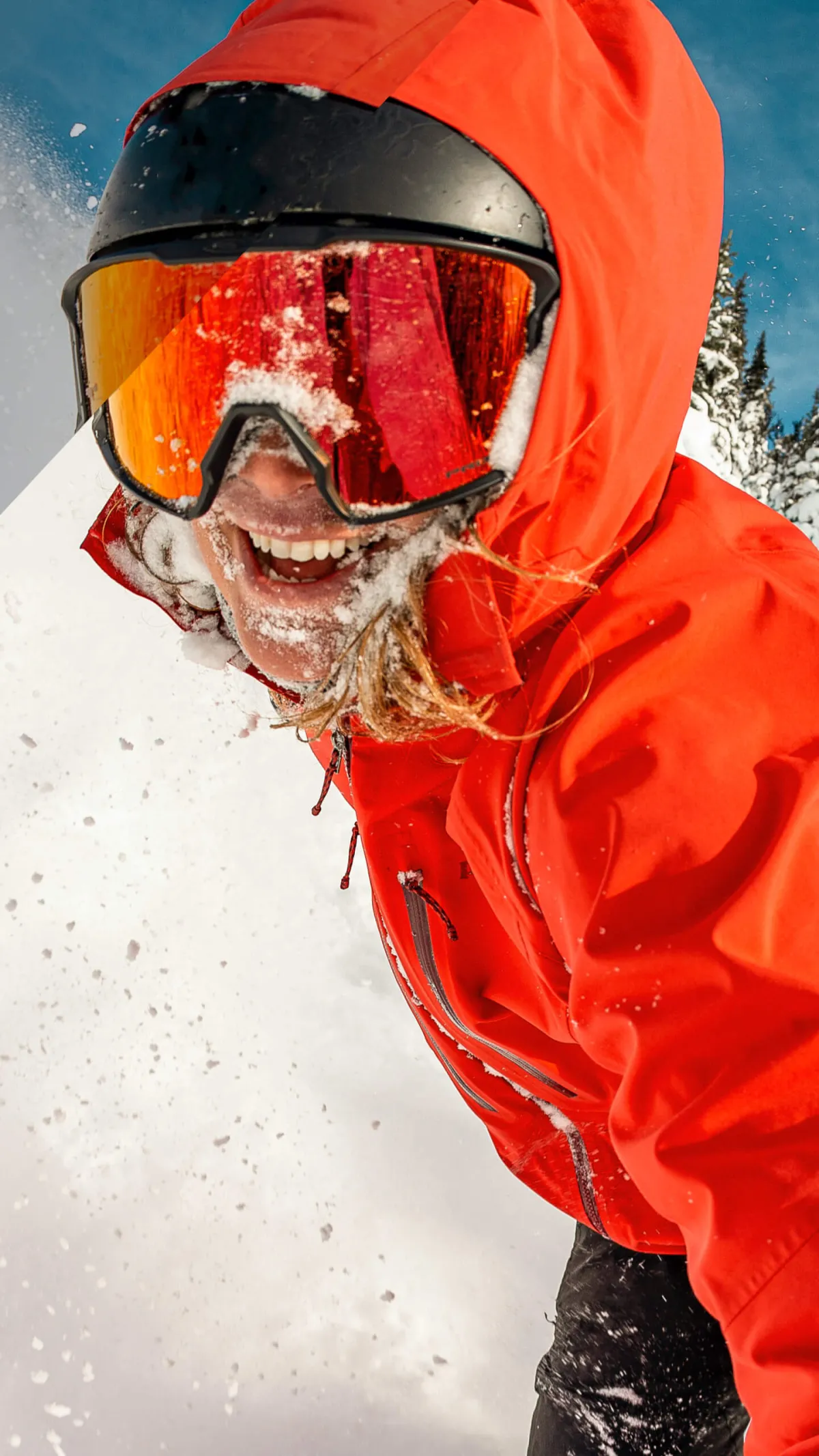 close up face shot of a person skiing powder