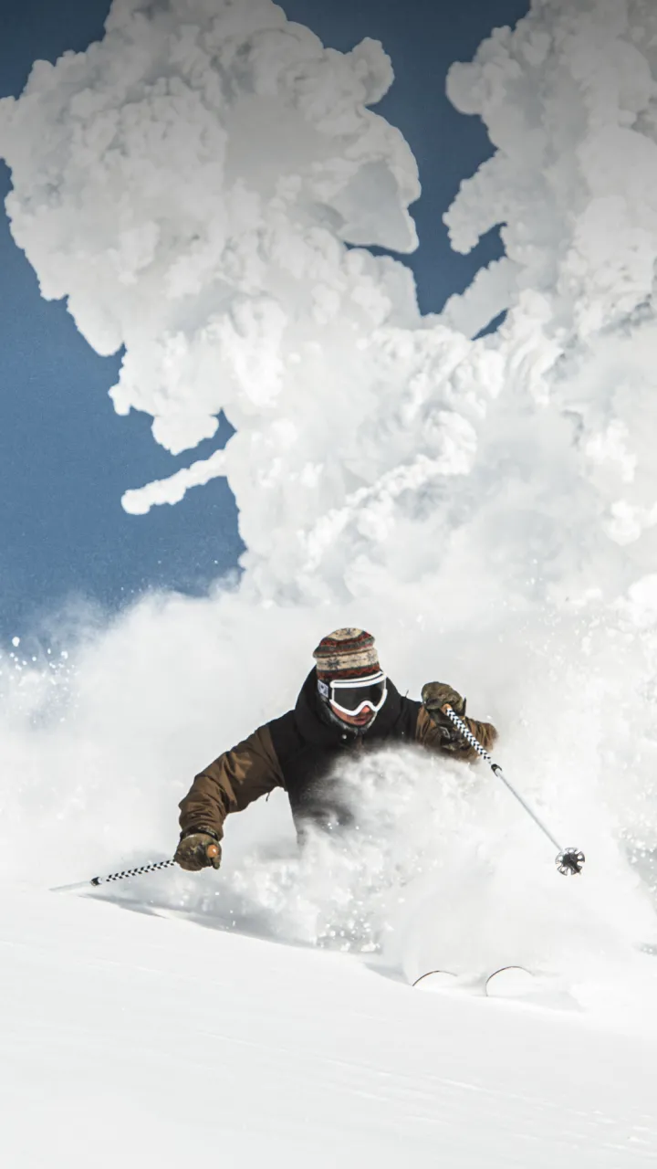 A person skiing through powder