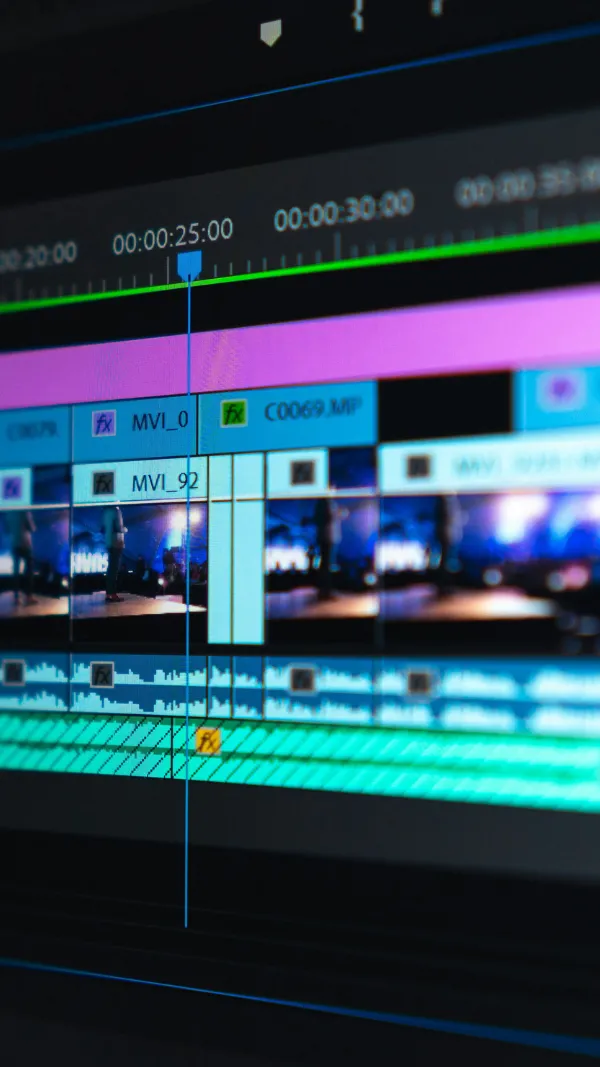 Video editing timeline with clips and tracks on a screen.