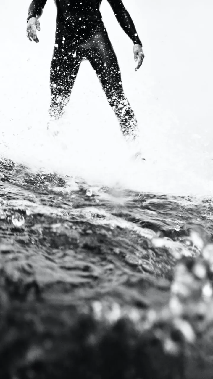 black and white image of surfer