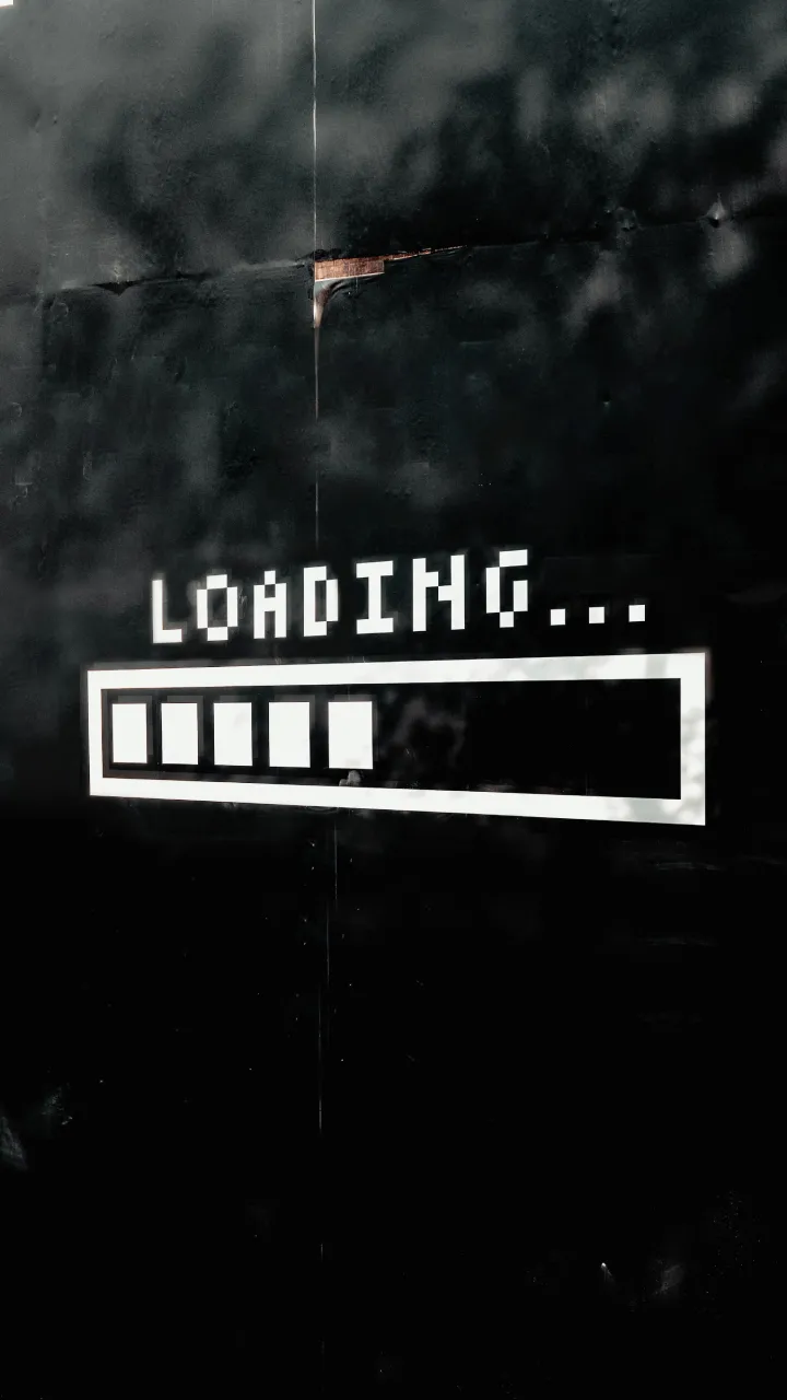 A dark background with a "loading" graphic