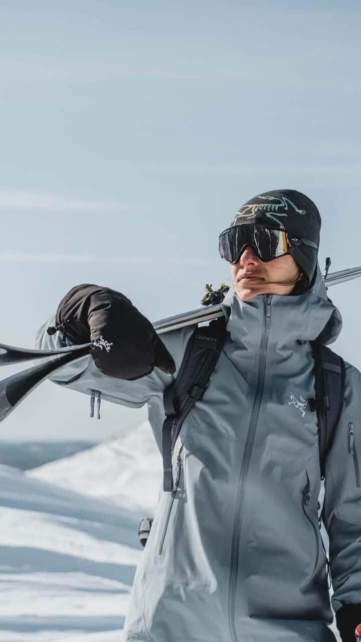 Women carrying skis