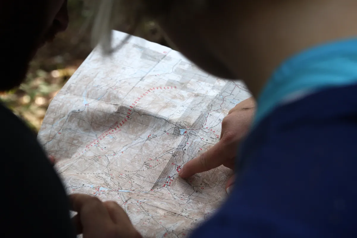 People looking at map in outdoors