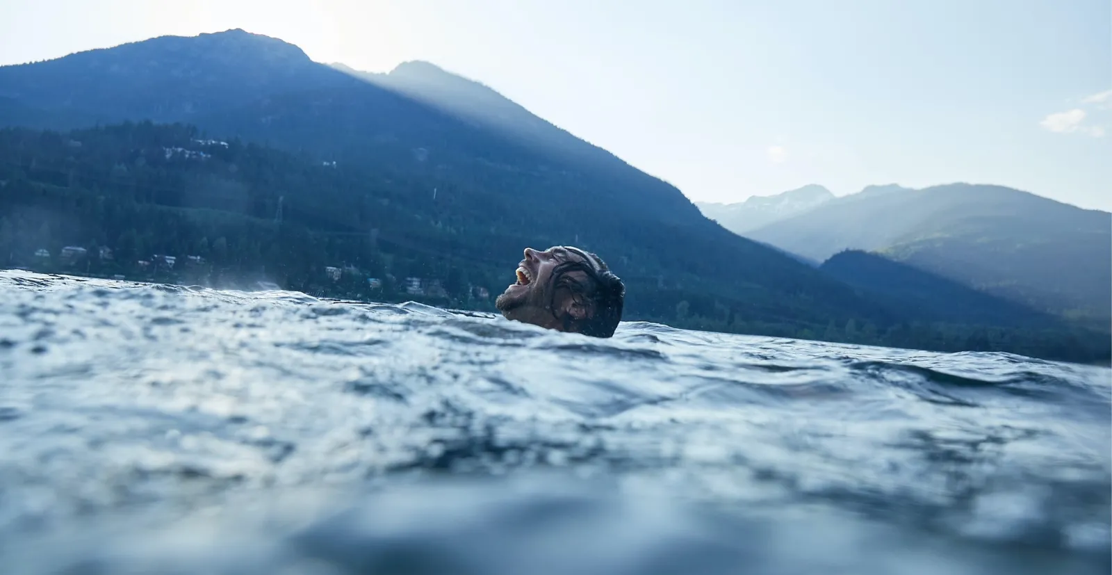 Person smiling and laughing in water