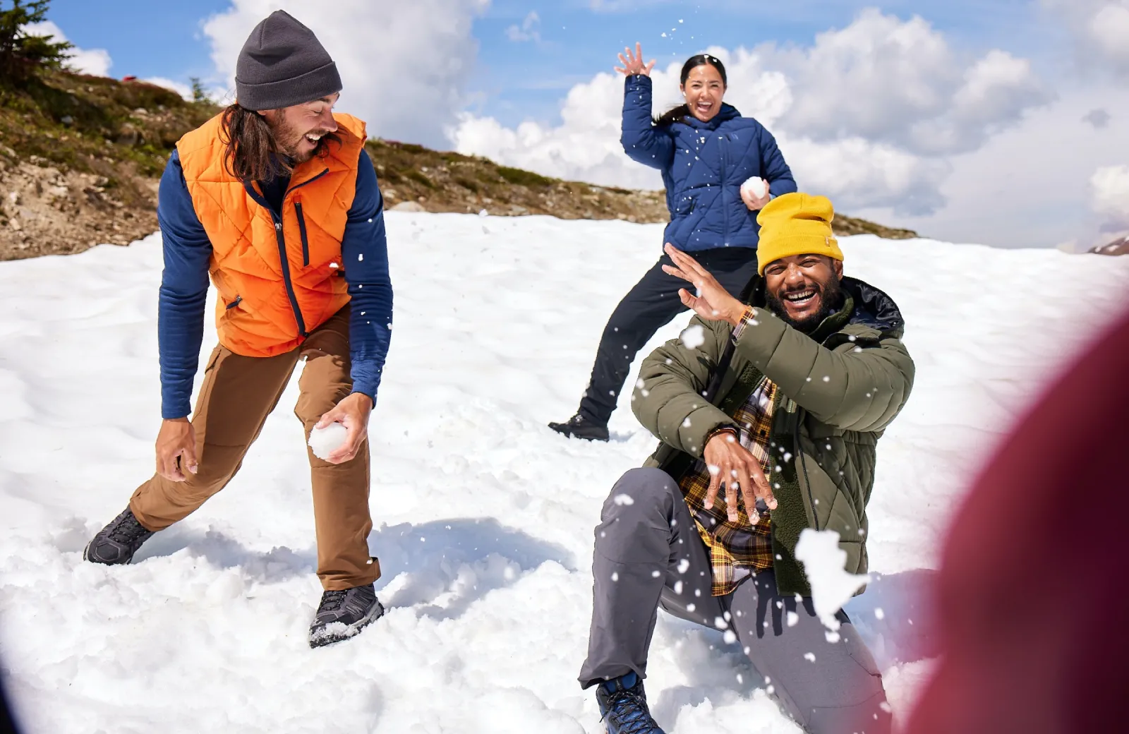 Friends having snowball fight