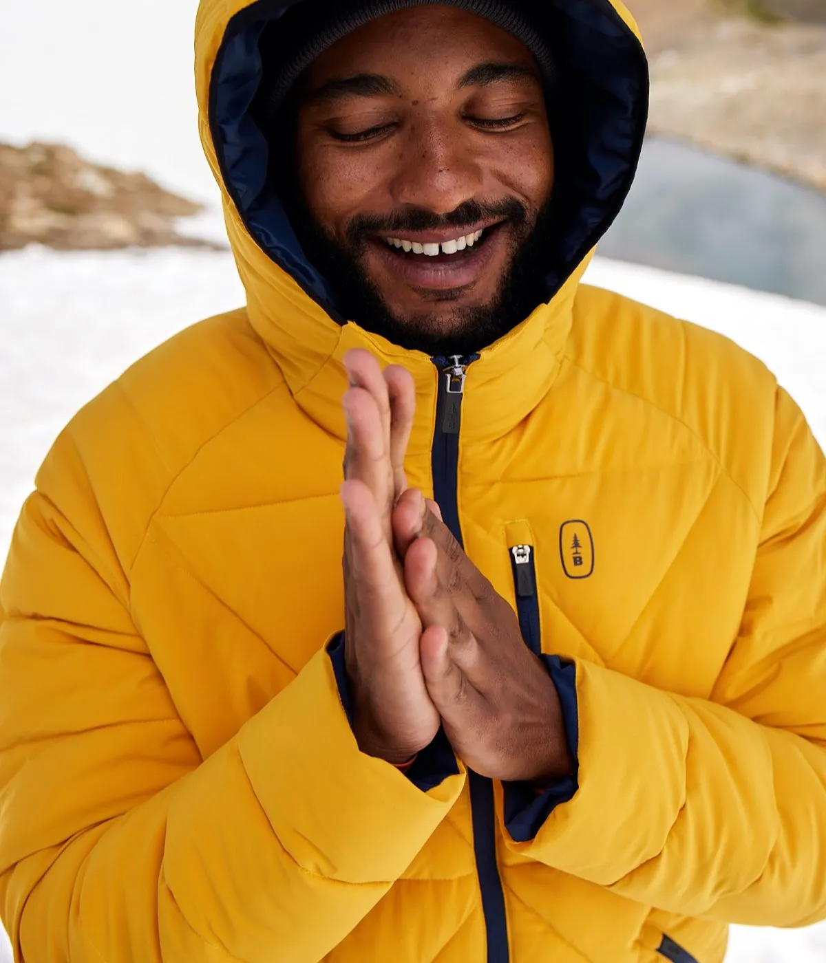 Person wearing yellow Bass Outdoor puffy