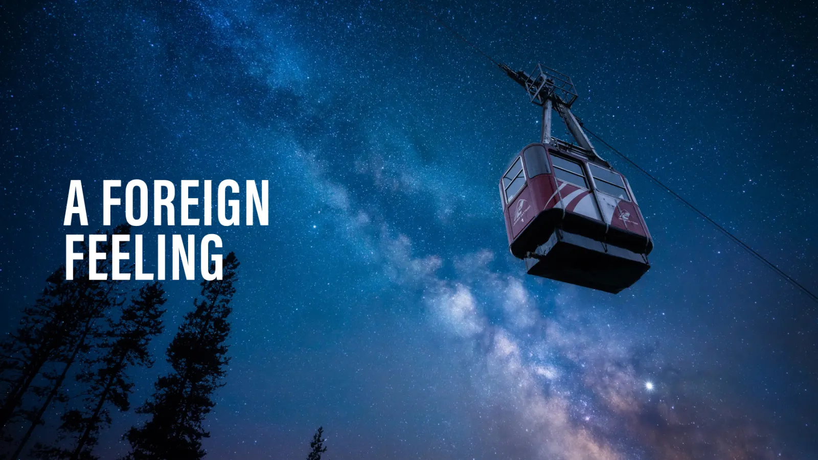 A gondola at night with a starry background reading 'A foreign feeling'