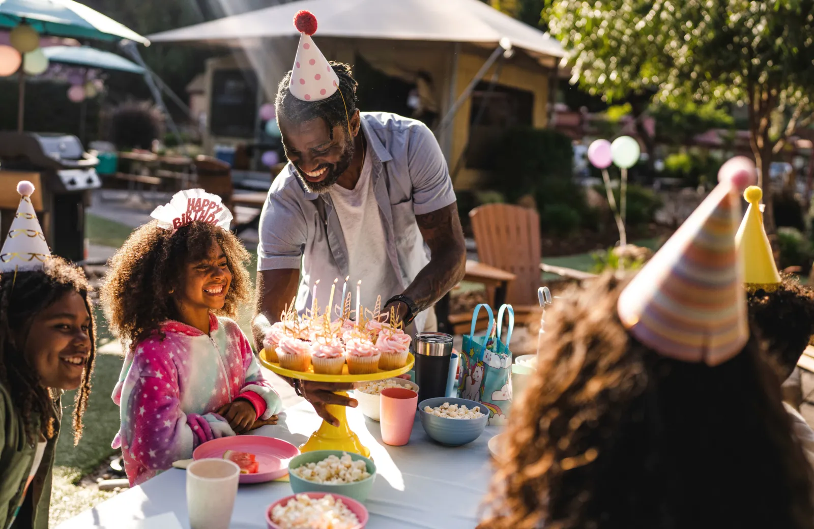 A family celebrating a birthday party at a campground