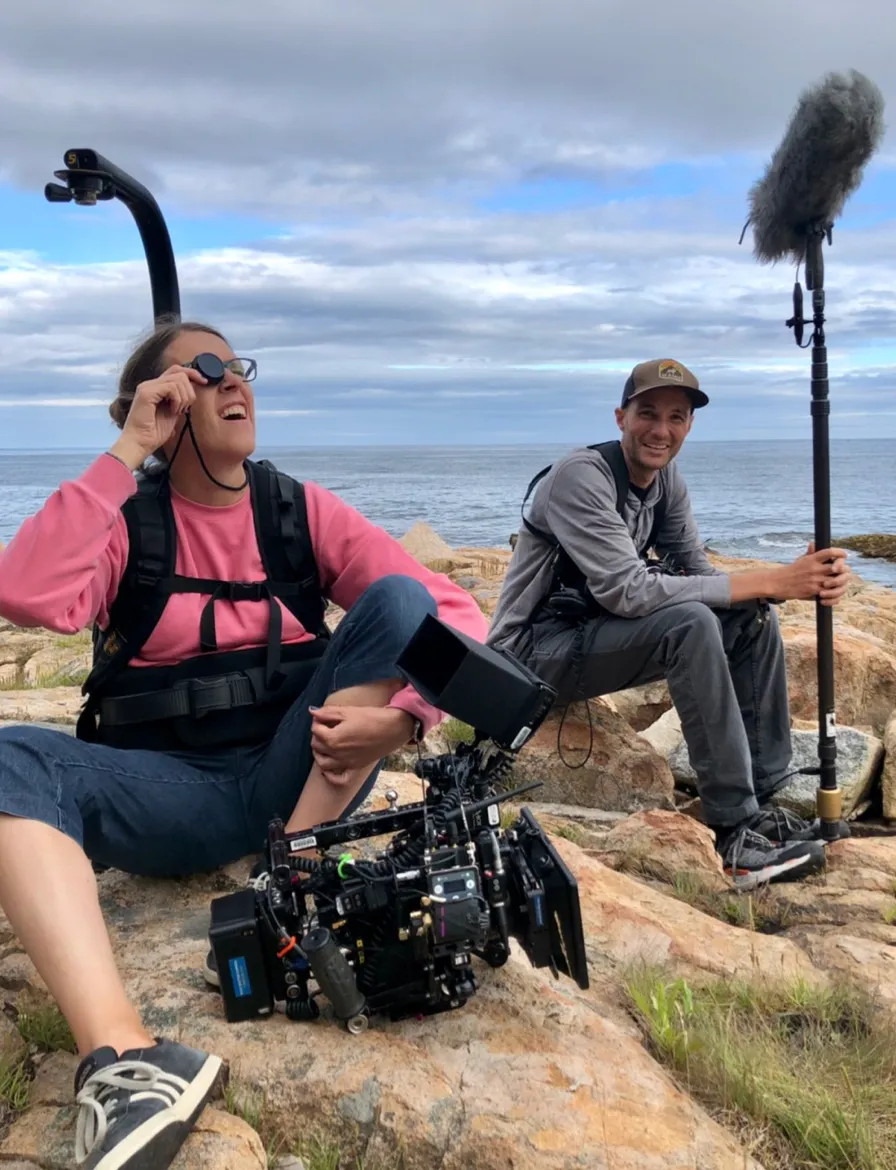 2 person resting outside while filimg