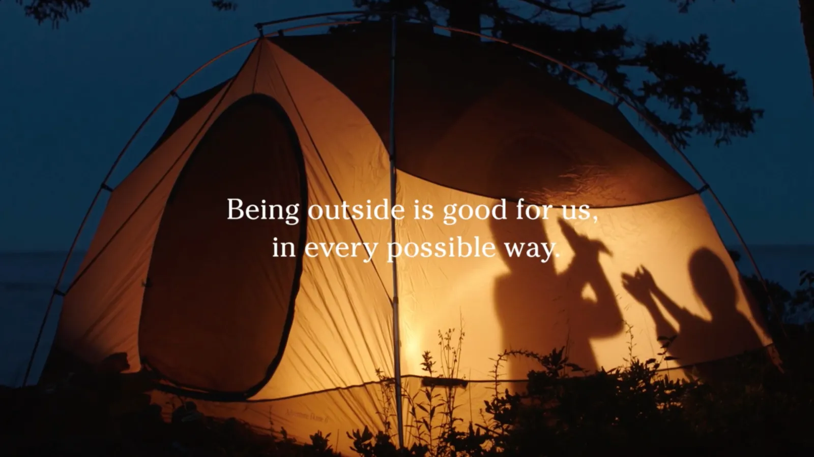 Kids in a tent at night, title: Being outside is good for us, in every possible way.