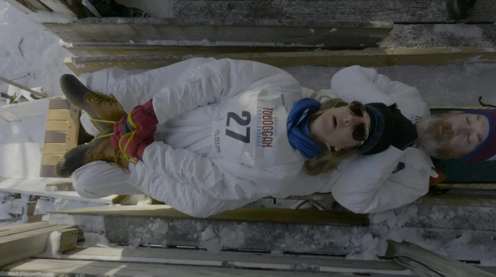 People getting ready to drop into the sled track