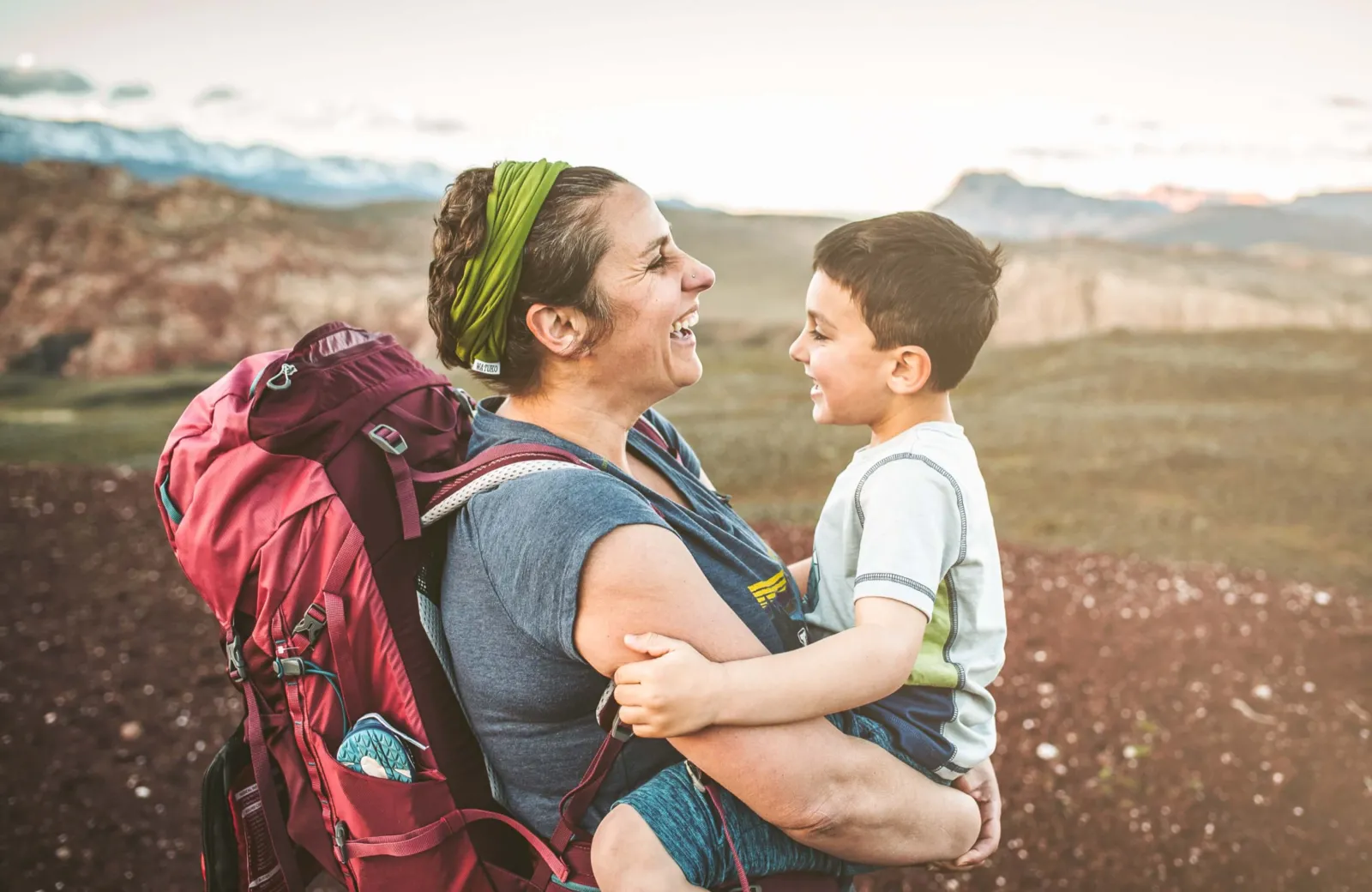 Mother carrying her child while hiking