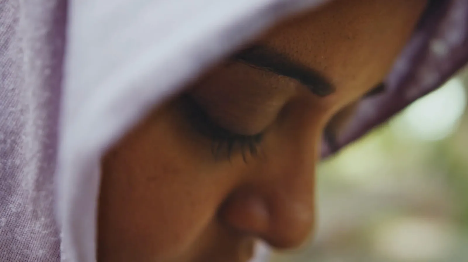 Side profile of main character praying