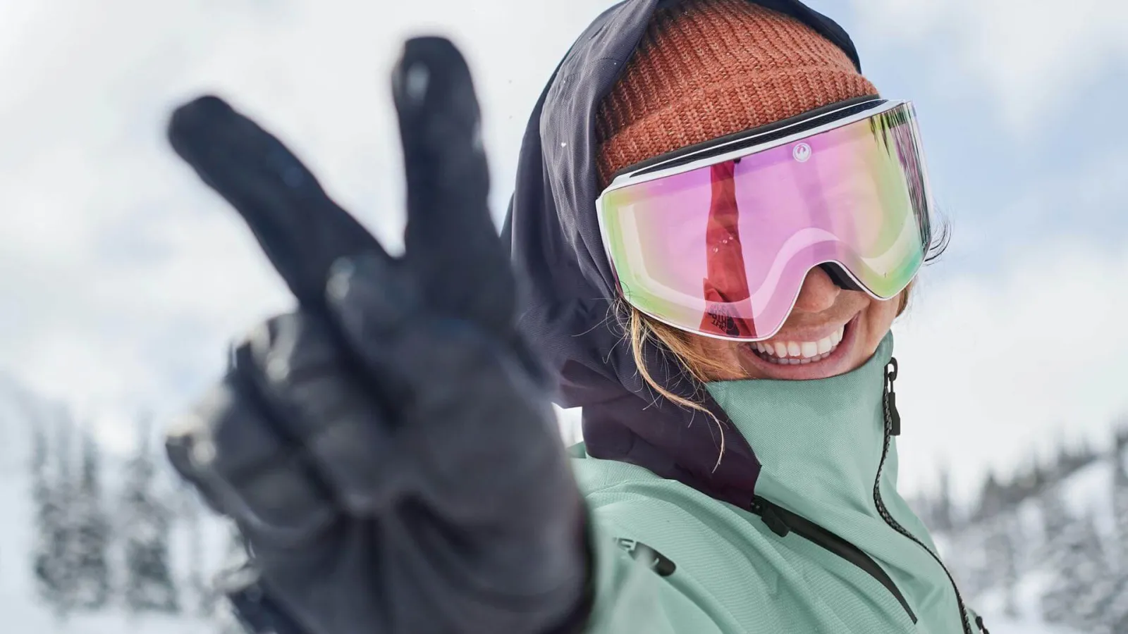 Girl smiling and posing with a peace sign