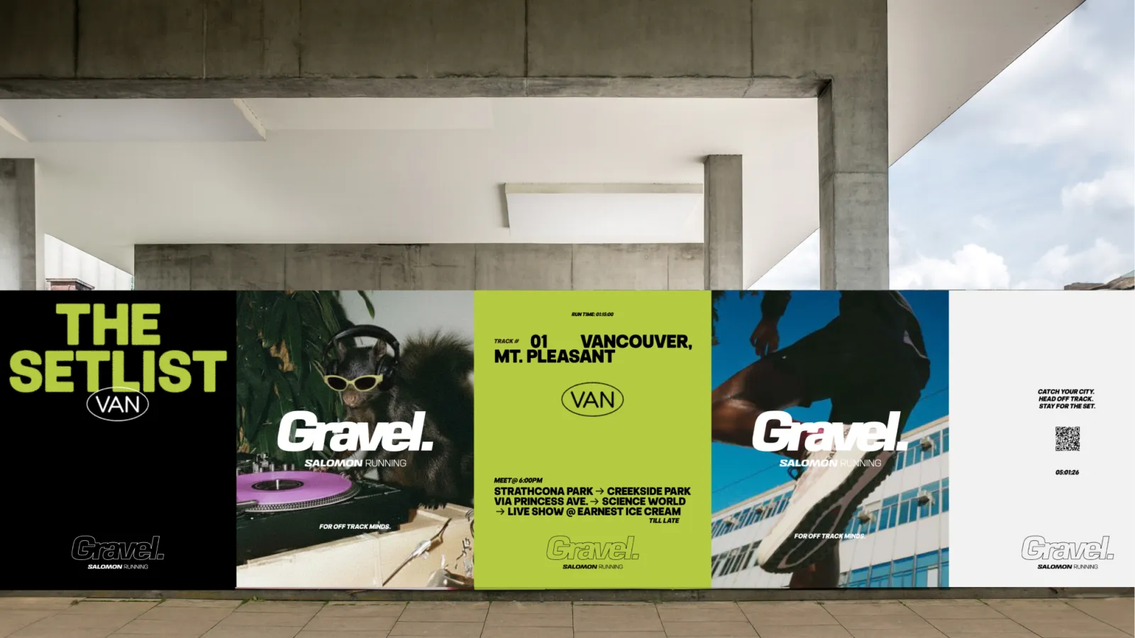 Advertising posters on a wall under a modern concrete structure.