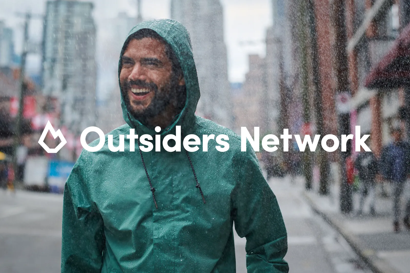 Man in the rain laughing