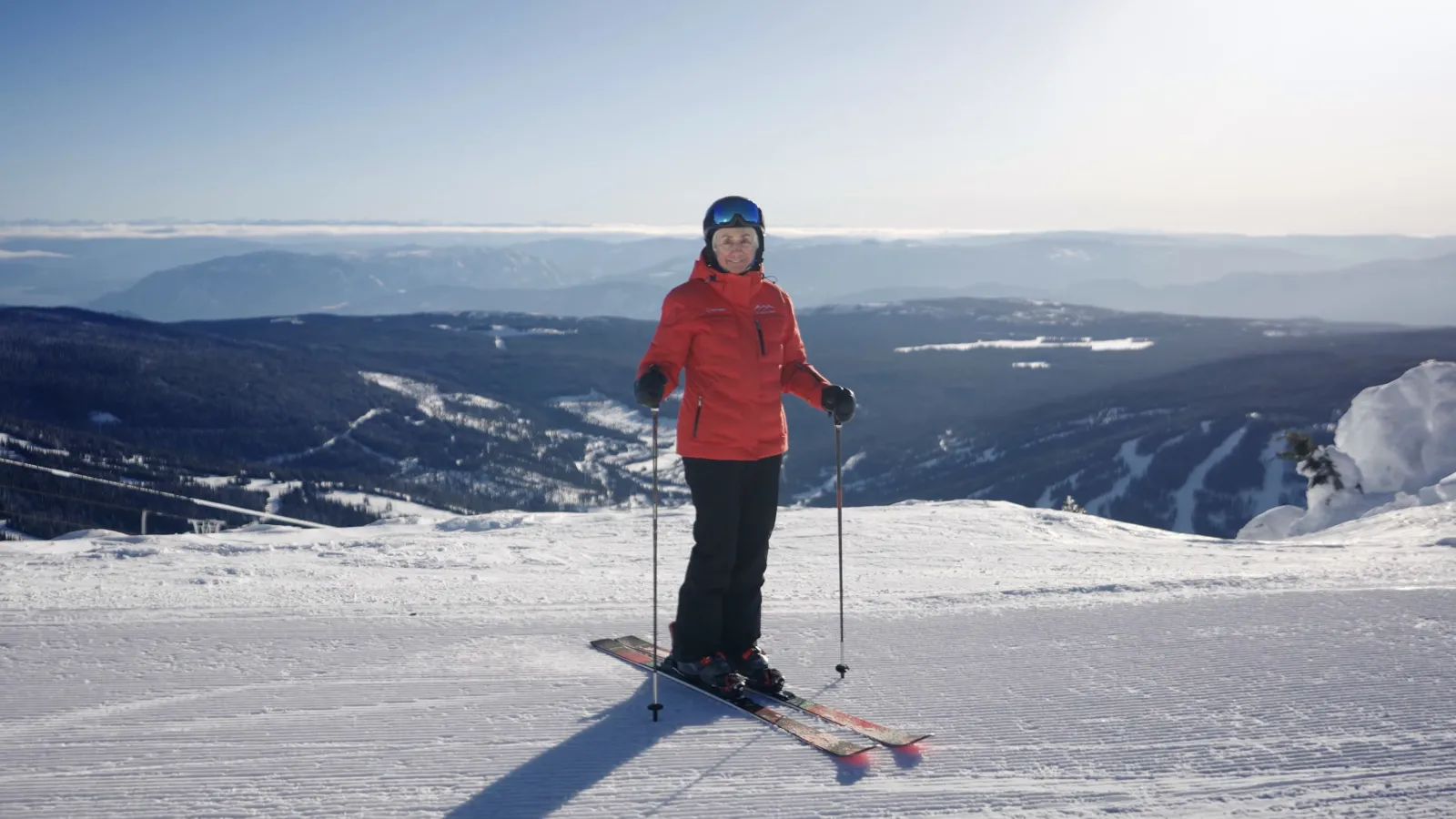 A portrait of Nancy Greene Raine on skis