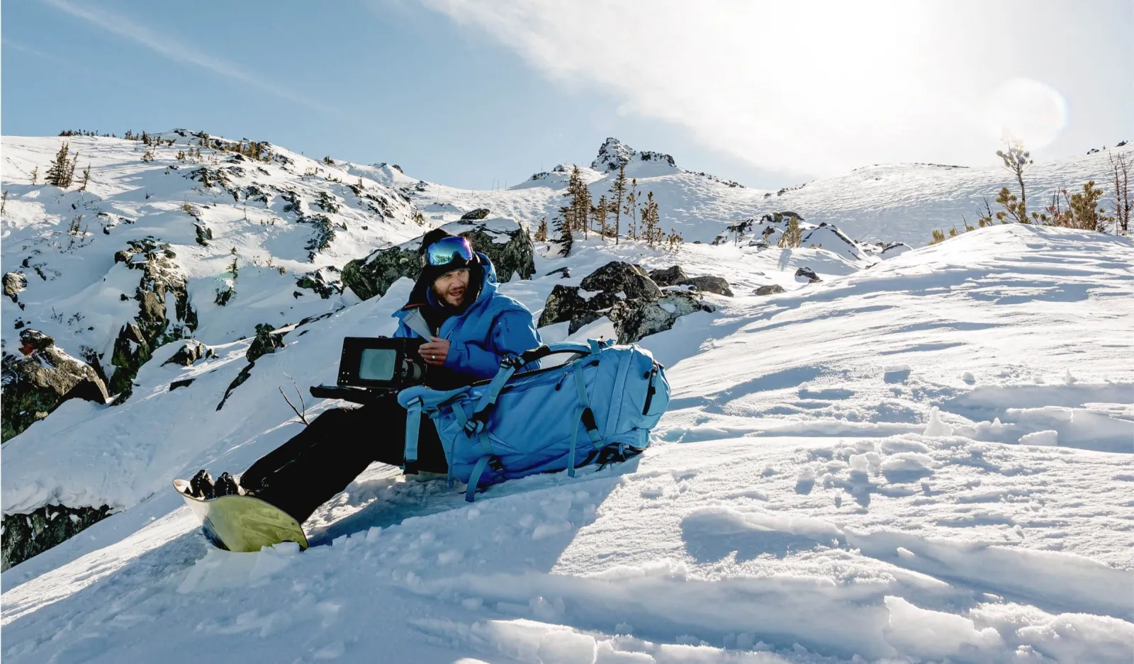 cinematographer sitting in snow