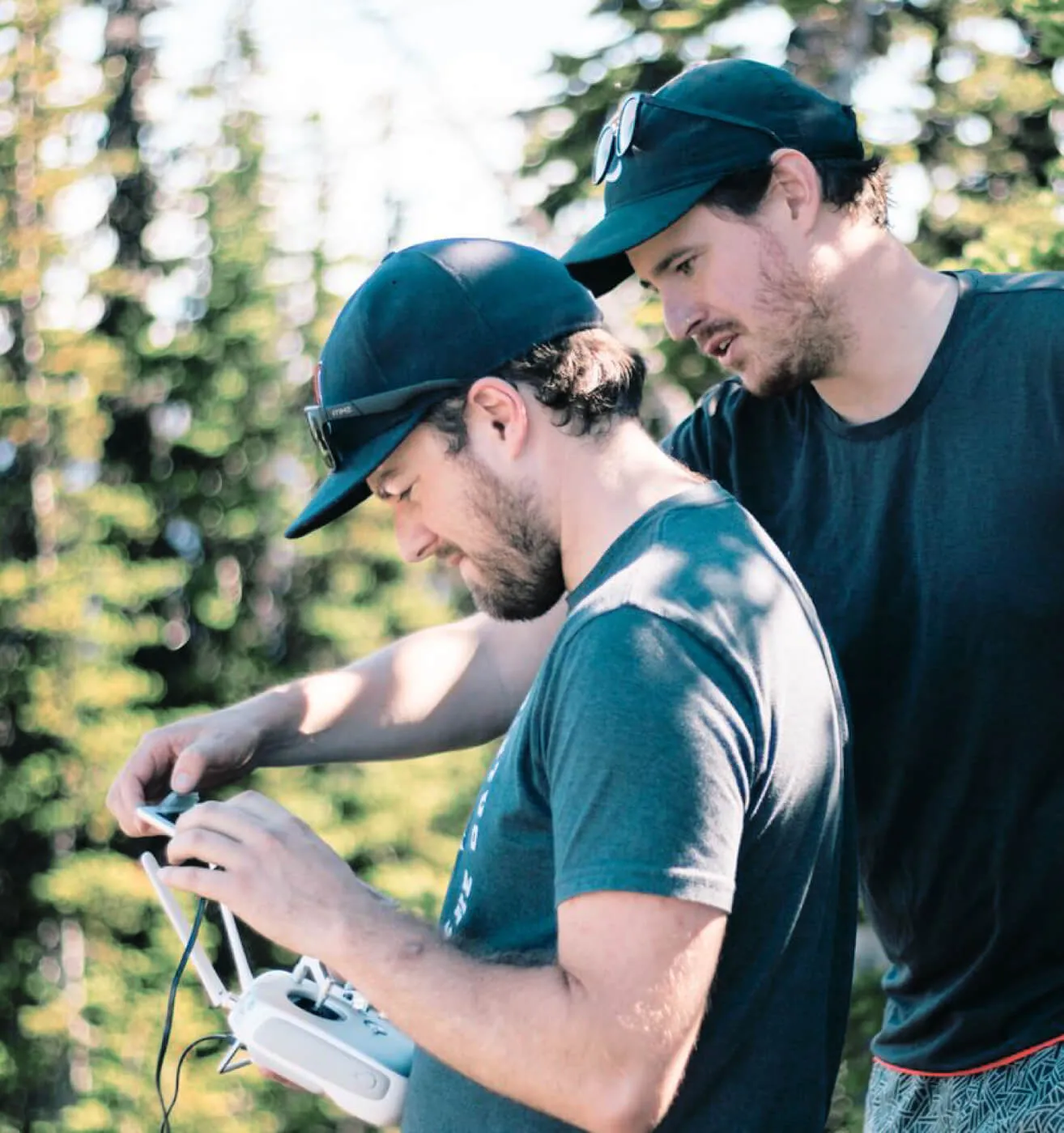 two Origin employees helping each other film