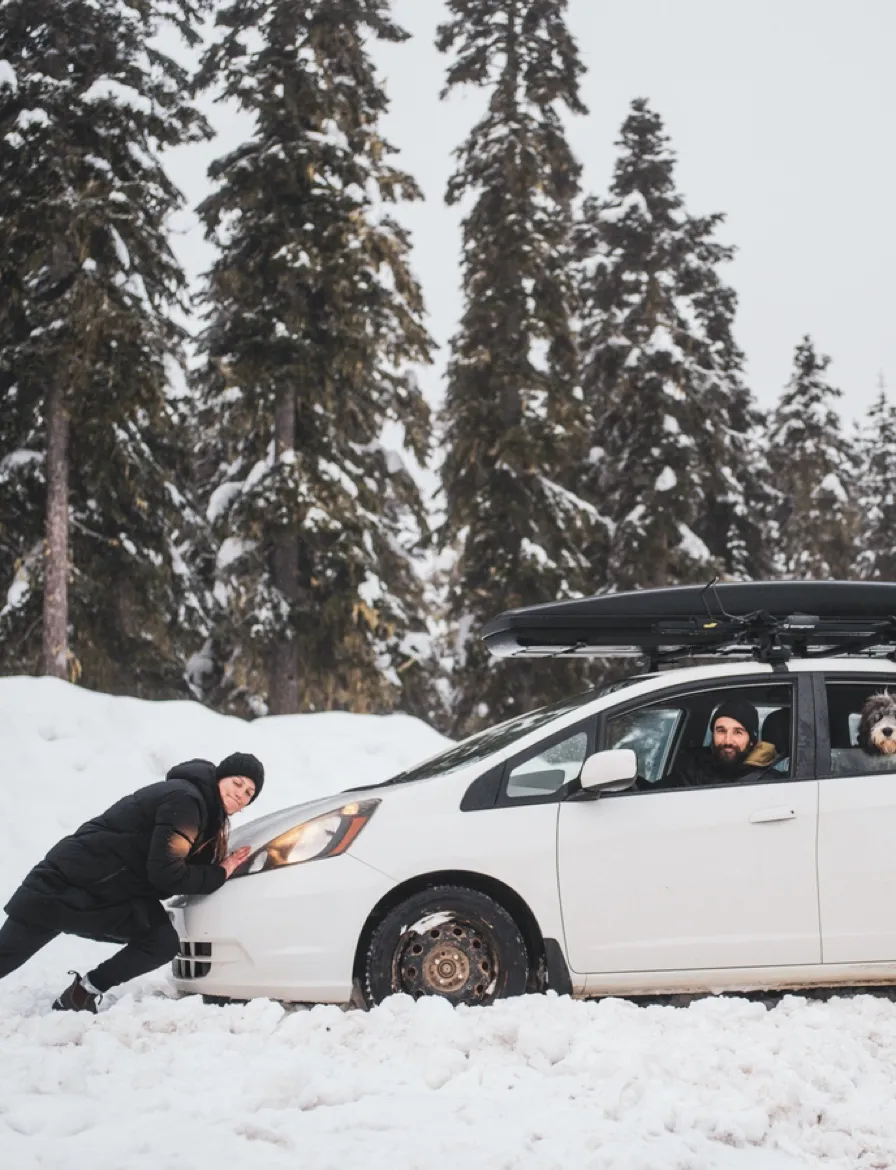 Pushing a car out of the snow