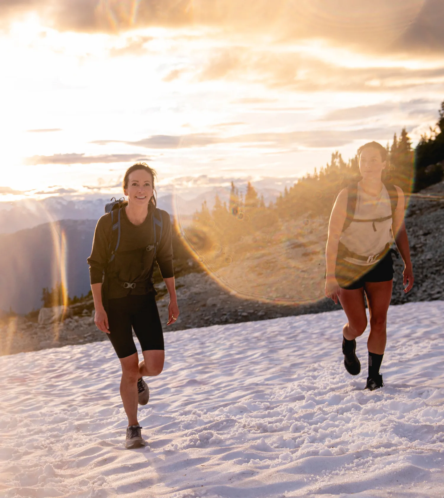 2 girls hiking on snow