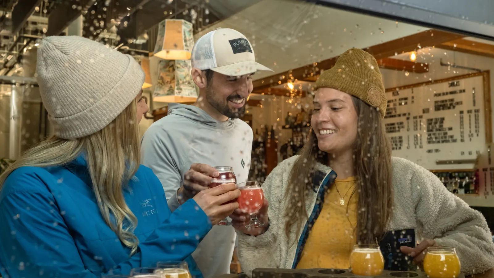 Three people having drinks in a bar