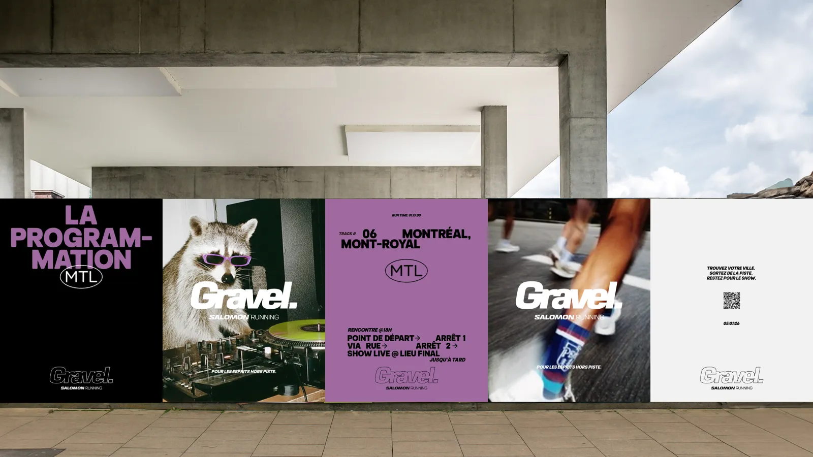 Posters displayed on an outdoor wall under a cloudy sky.
