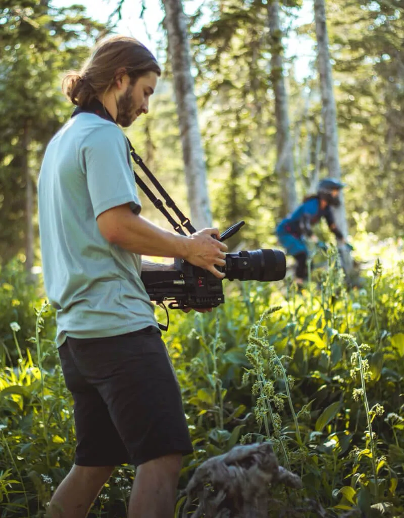 Staff member working with video camera