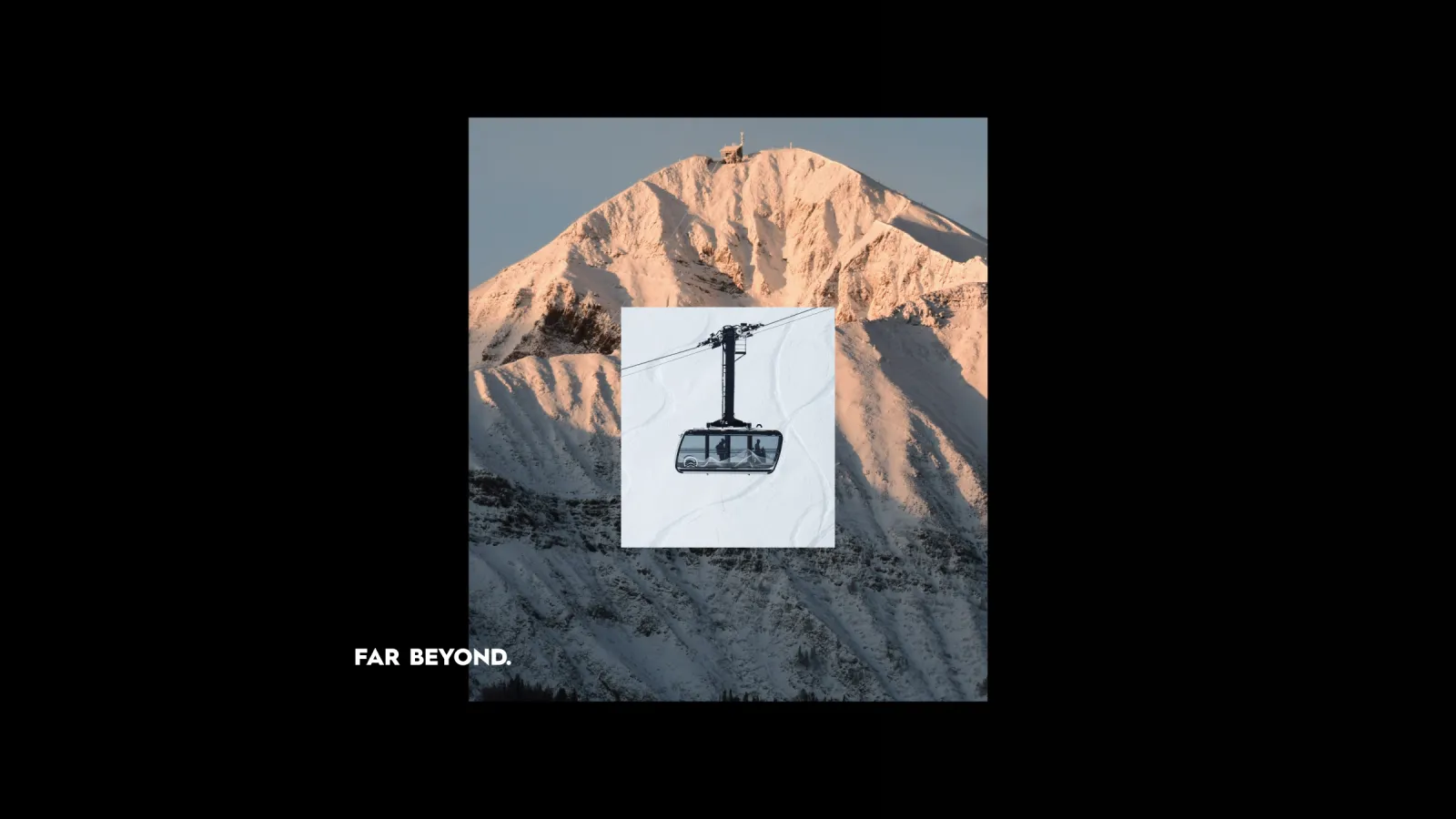 Cable car in front of a sunlit snowy mountain.