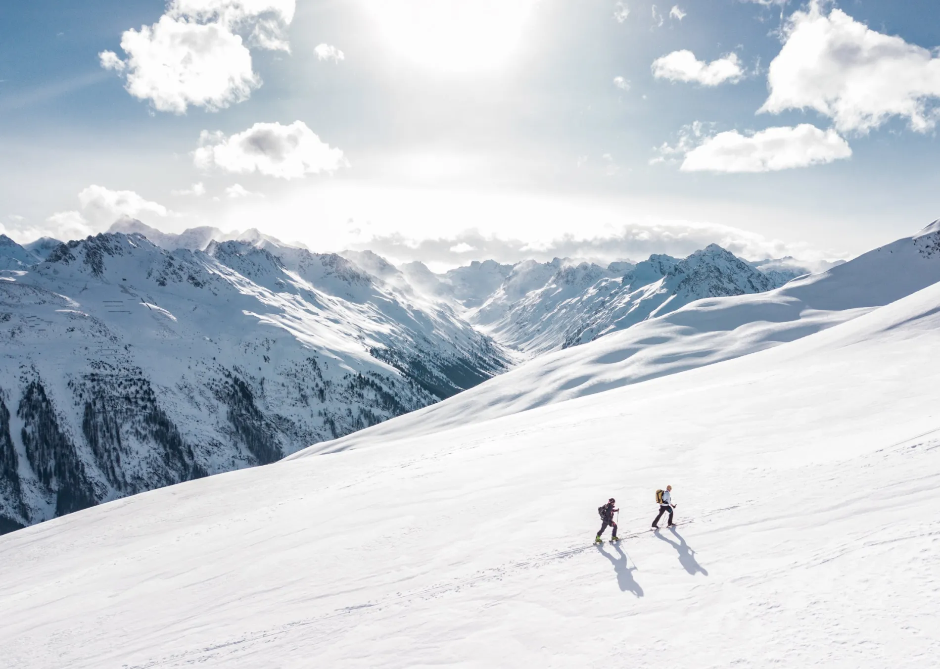Two backcountry skiers touring in the mountains