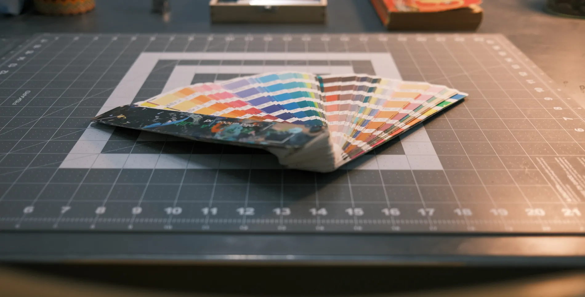 A Pantone swatch book on a desk