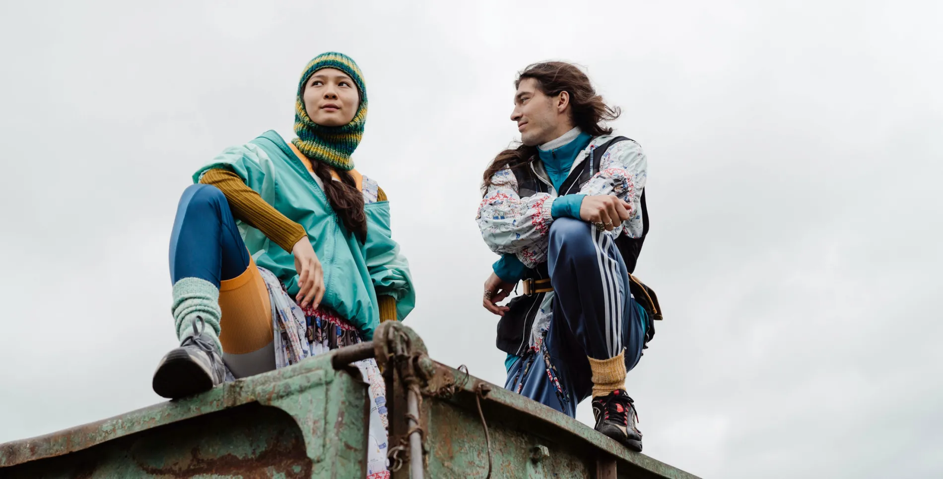 2 people posing in various items of outdoor clothing