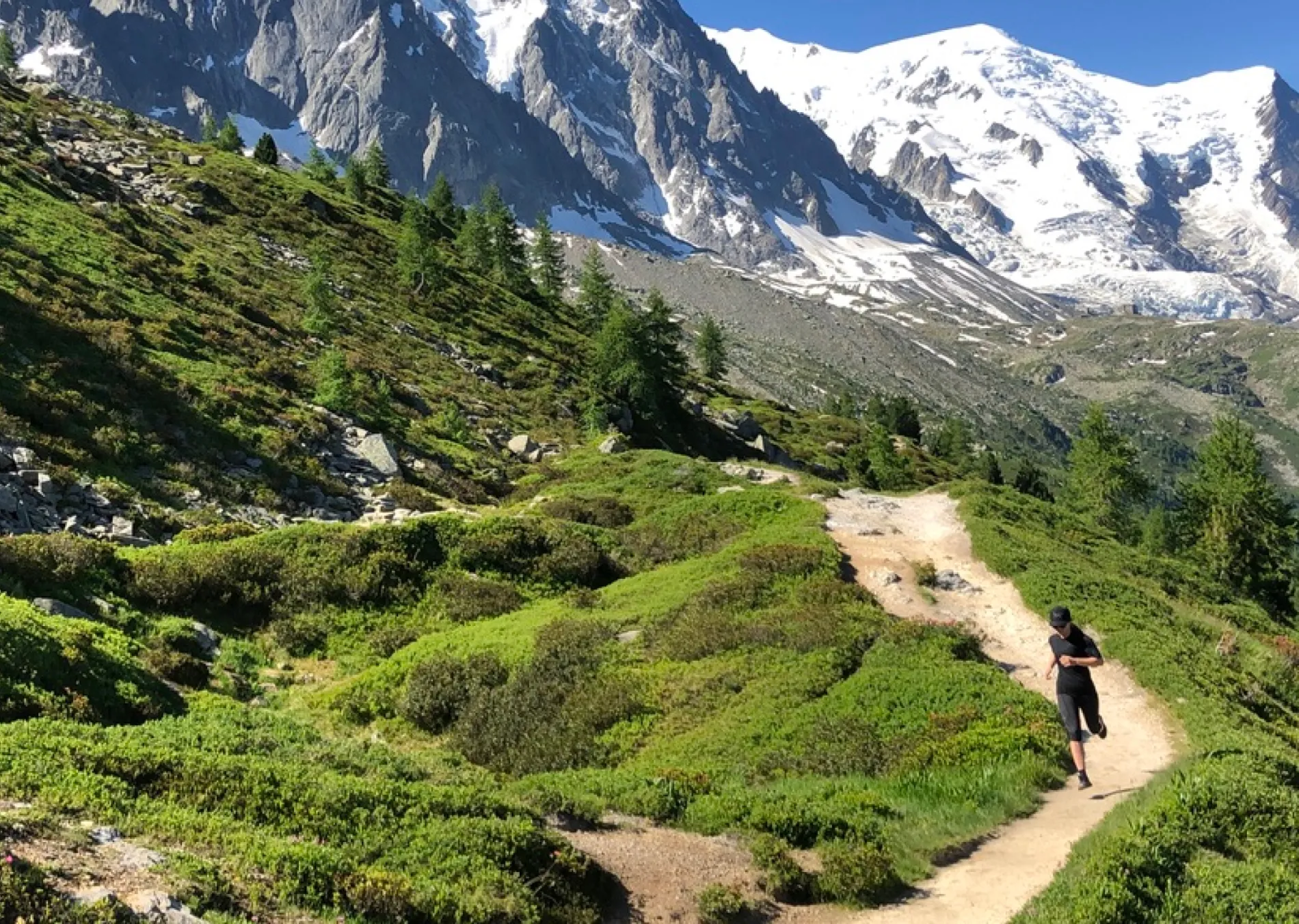 woman running on mountain trail