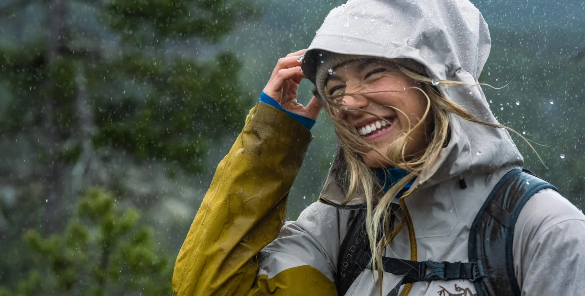 A woman laughing in the rain