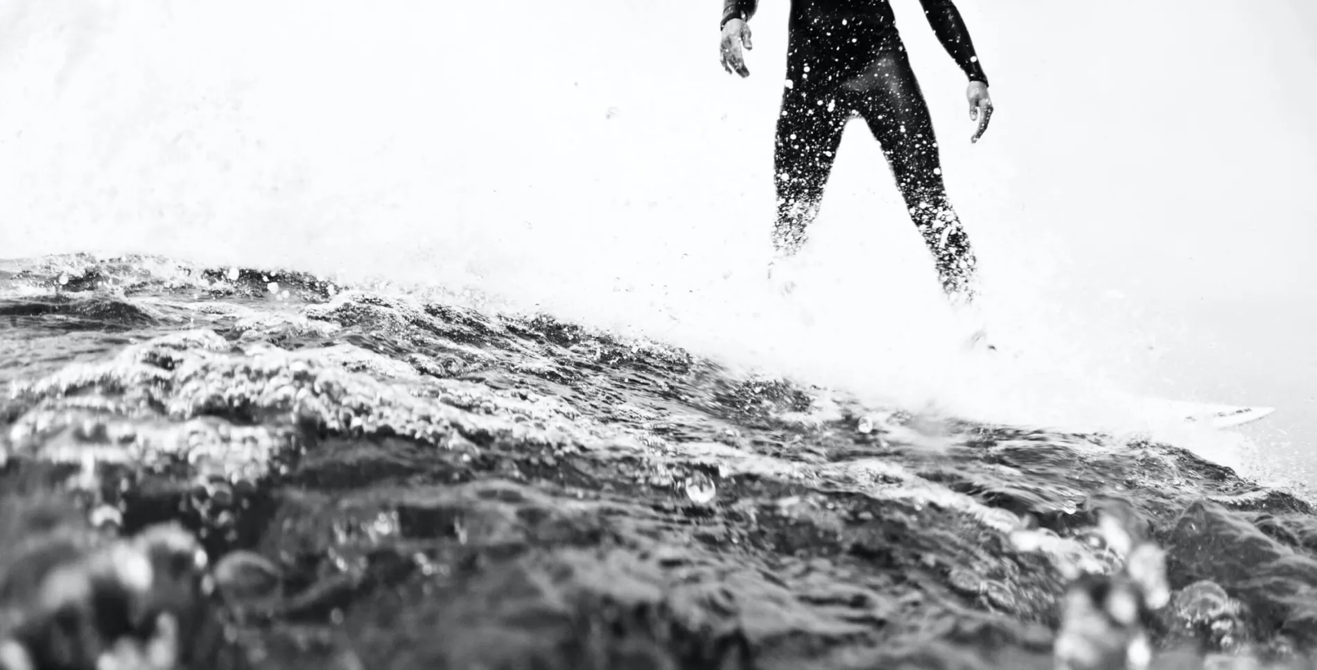 black and white image of surfer