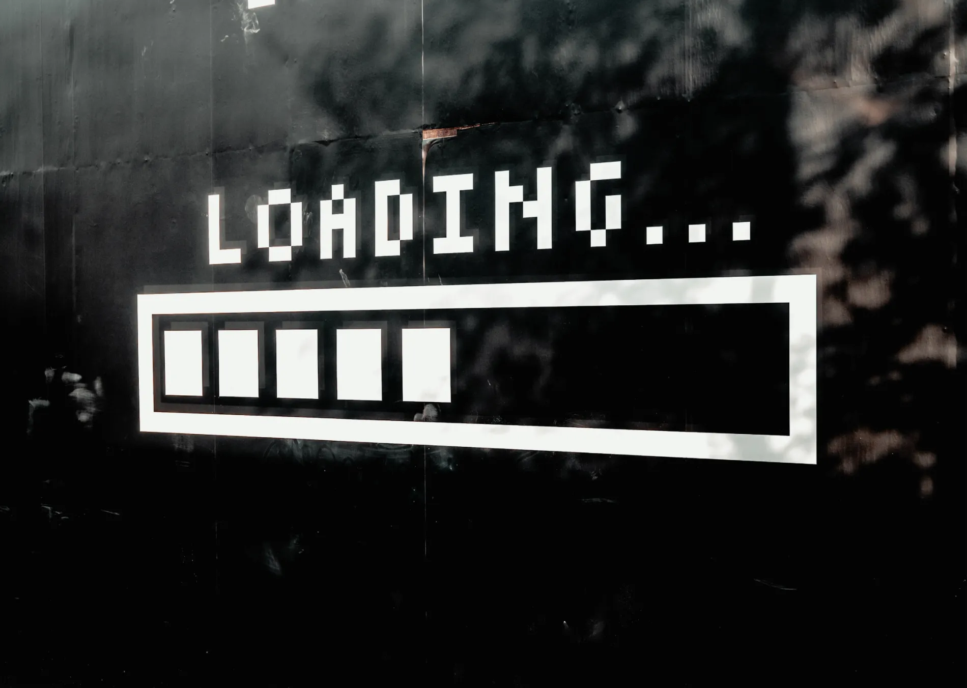 A dark background with a "loading" graphic