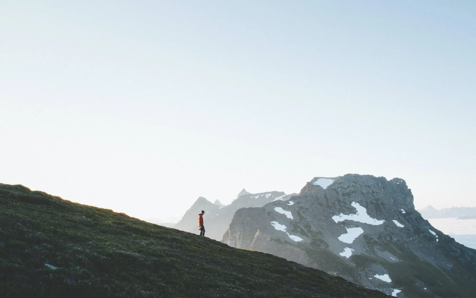 person standing atop a mountain