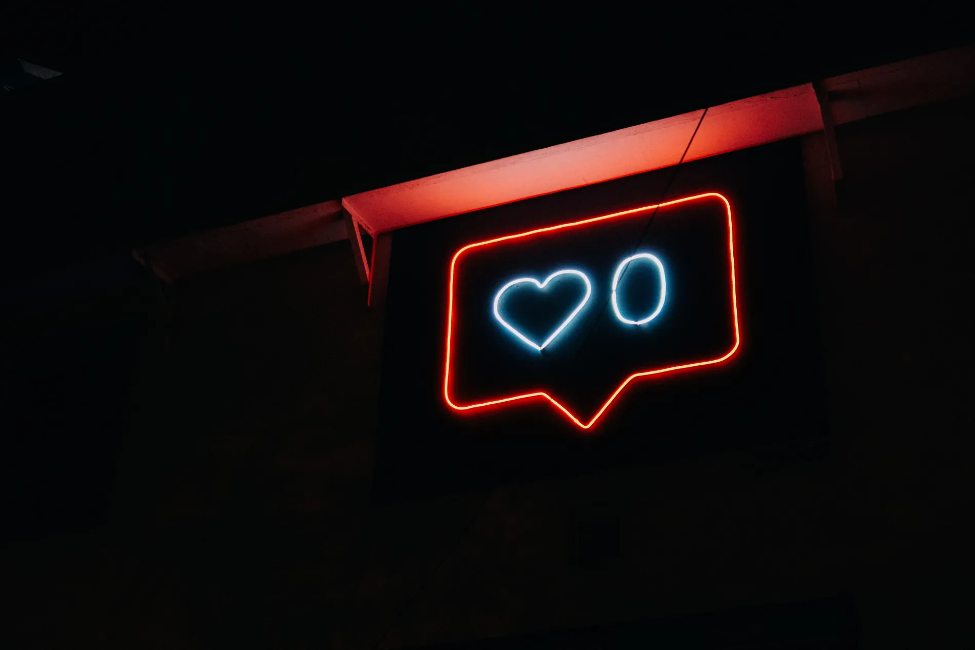 neon sign with likes icon